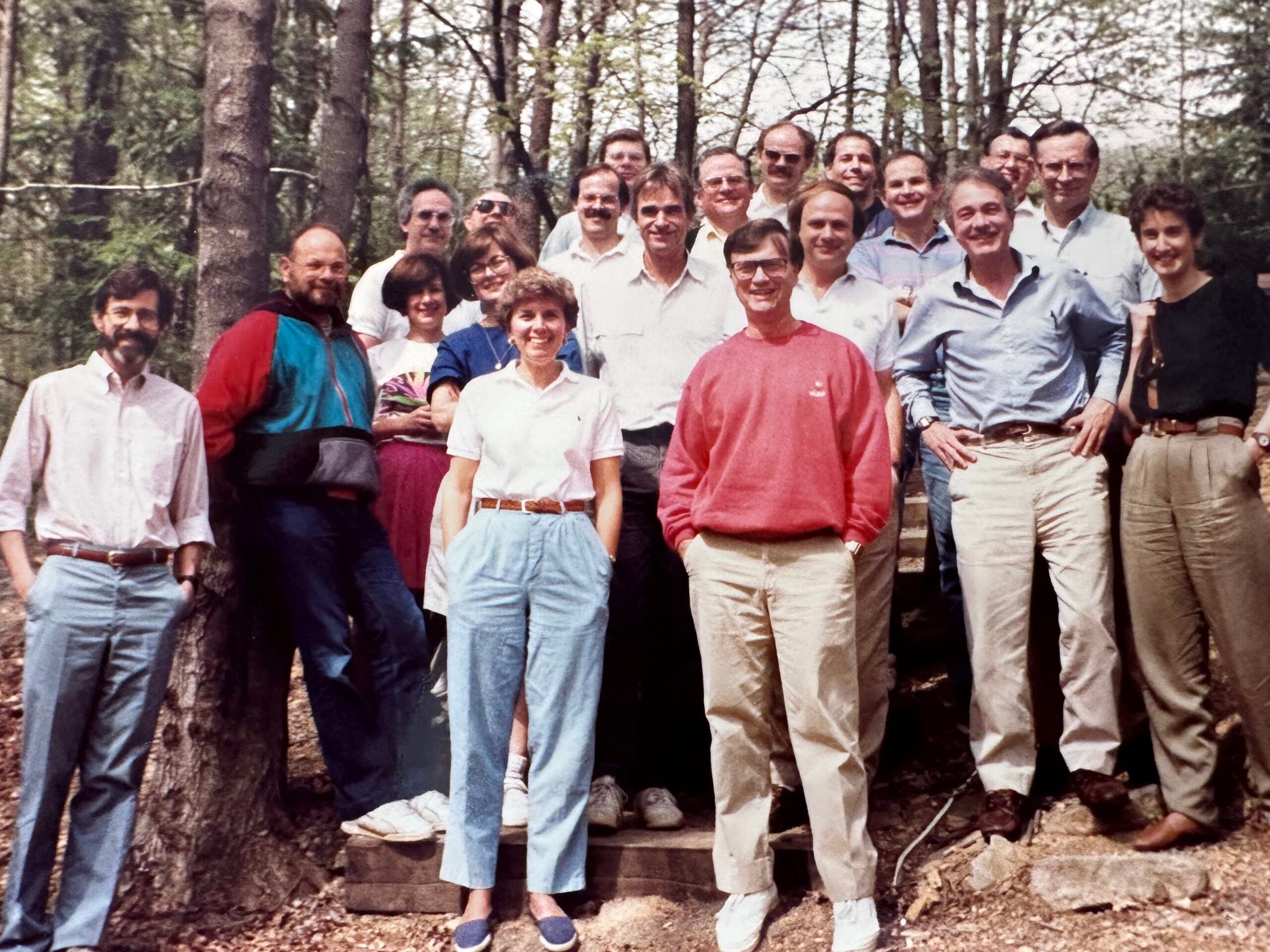 Faculty of the department at a retreat in the woods in 1990